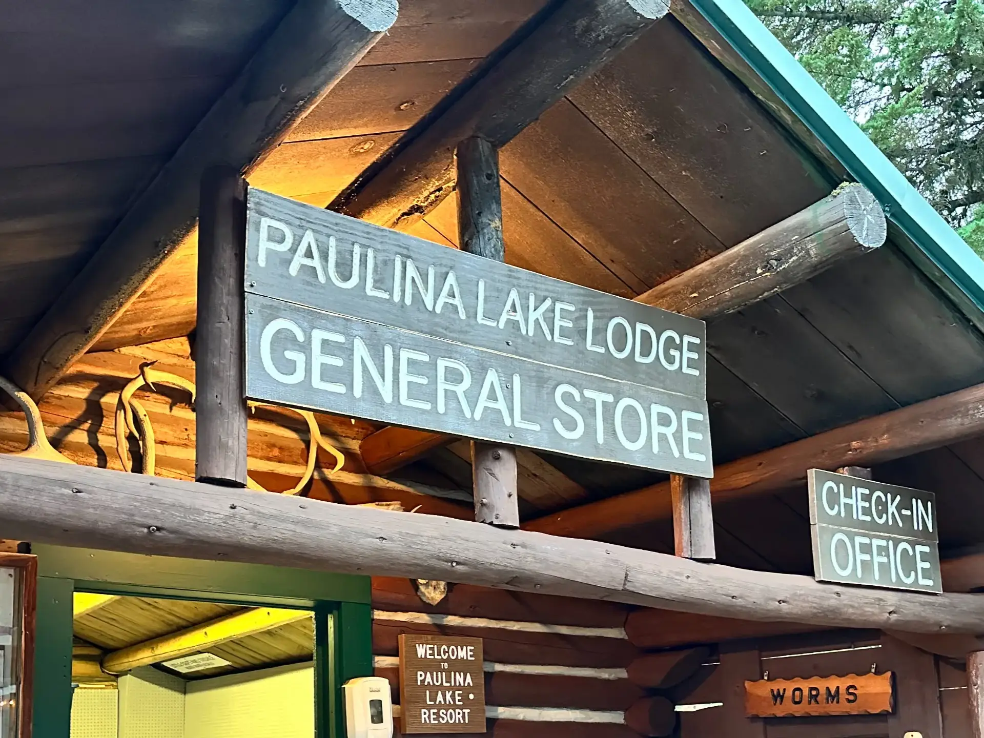 Signage for Paulina Lake Lodge, including the general store and check-in office.